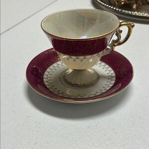 Elegant Gold and Burgundy Teacup and Saucer